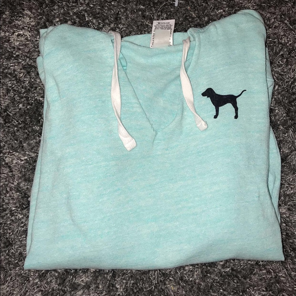 A turquoise/blue sweater shirt.